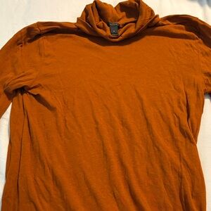 Woman Orange turtle neck goes great with the Tommy Hilfiger pants listed